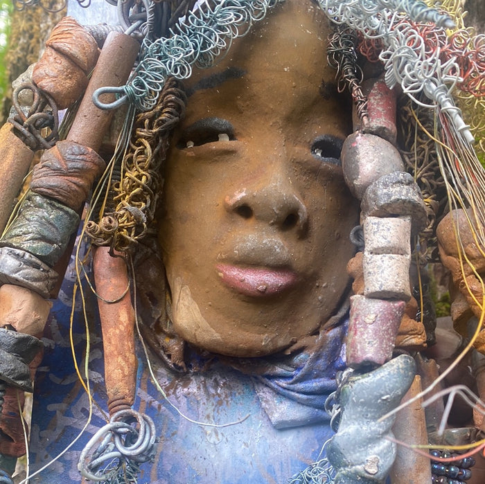 Valarie is mounted 5โ x 8 x 1 and weighs 1.13 lbs. She has a contagious smile. Valarie face has a lovely honey brown complexion. She has over 20 handmade raku fired beads Over 60 feet of 16 and 24 gauge twisted wire for hair!