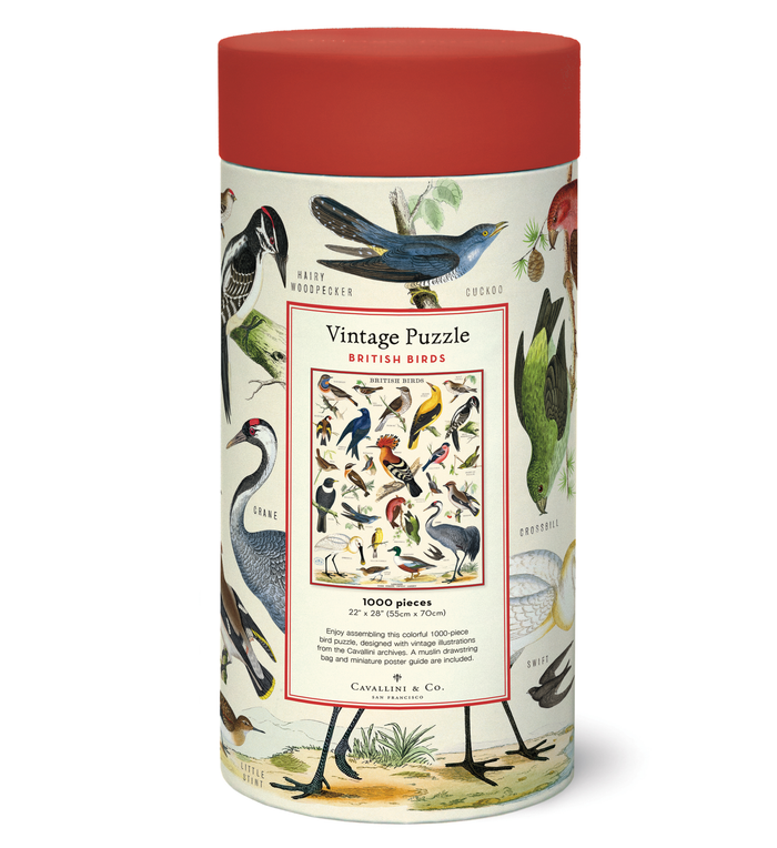 A cylindrical puzzle box labeled "British Birds Puzzle" from the Cavallini Papers & Co archives, with illustrations of various bird species on it.