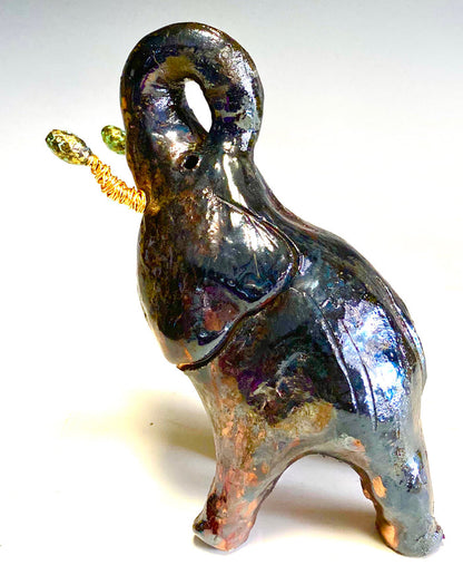 Raku Elephant Have you HERD!!!!!!  Just one of these lovely Raku Fired Elephant will make an excellent gift for your  friend, sorority or for your home’ special place centerpiece.  6" x 4" x 3" 13 ozs. Beautiful  dark copper metallic  raku elephant For decorative purposely only.