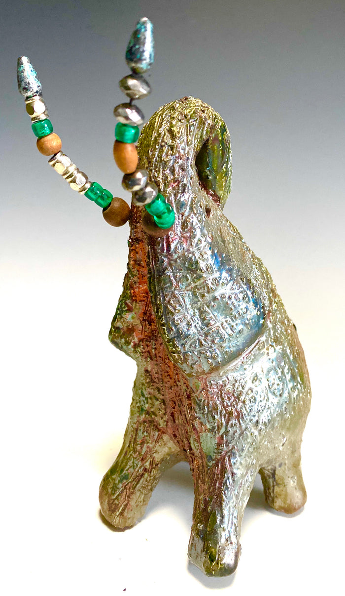 Raku Elephant Have you HERD!!!!!!  Just one of these lovely Raku Fired Elephant will make an excellent gift for your  friend, sorority or for your home’ special place centerpiece.  7.5" x 4" x 7" 1.10 lbs Multi beaded tusk Beautiful metallic copper gold raku glazes For decorative purposely only.