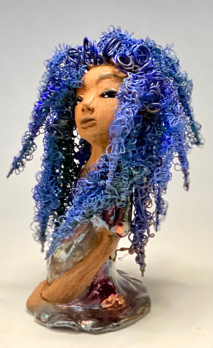 Rachel Rachel stands 8" x 6" x 5.5" and weighs 1.9 lbs. She has a lovely honey brown complexion with cocoa brown lips. She has long twisted wire locs hairstyle waist down!  Rachel has a very colorful metallic  copper blue antique glazed dress. She has over 75 feet of 16 and 24 gauge  wire for hair. It took over 6 hours just to do her hair! With  eyes wide opened, Rachel has hope of finding a new home.