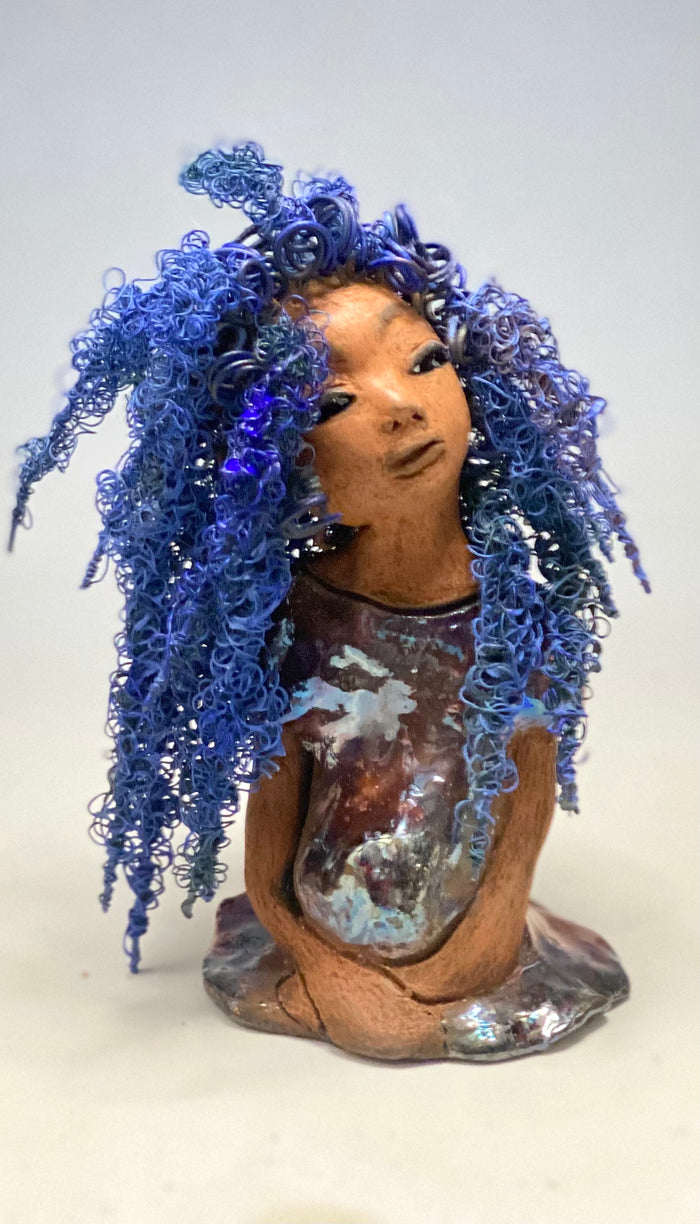 Rachel Rachel stands 8" x 6" x 5.5" and weighs 1.9 lbs. She has a lovely honey brown complexion with cocoa brown lips. She has long twisted wire locs hairstyle waist down!  Rachel has a very colorful metallic  copper blue antique glazed dress. She has over 75 feet of 16 and 24 gauge  wire for hair. It took over 6 hours just to do her hair! With  eyes wide opened, Rachel has hope of finding a new home.