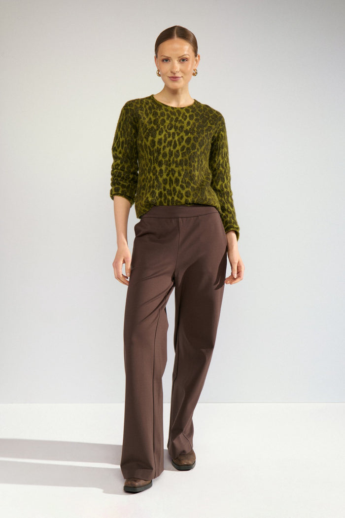 Model wearing Numph 707215 Nuriette Leo Jumper Calla Green by Numph, shop the brand at Dotique for stylish knitwear options