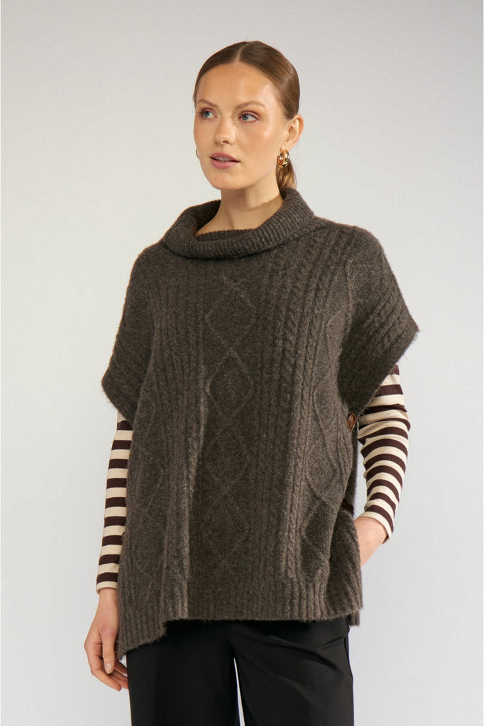 Model wearing Numph 707241 Nujoline Poncho Black Coffee by Numph, shop the vendor at Dotique for cozy layering options
