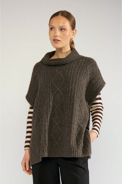 Model wearing Numph 707241 Nujoline Poncho Black Coffee by Numph, shop the vendor at Dotique for cozy layering options