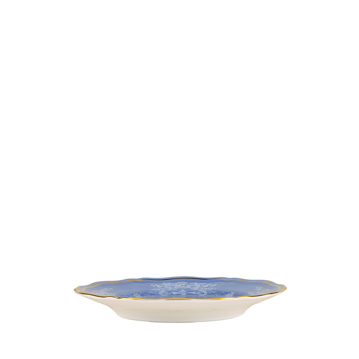 Round bread and butter plate with scalloped edges, blue floral center, and gold rim trim.