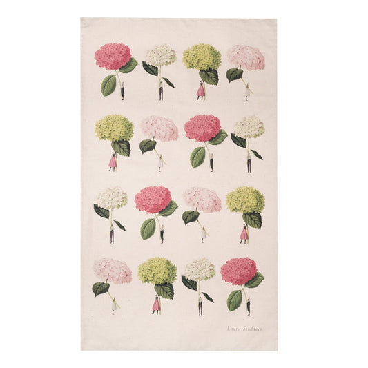 A natural linen tea towel featuring a grid of 16 illustrations of small people holding gigantic hydrangea blooms by the stems, in pink, white and green.