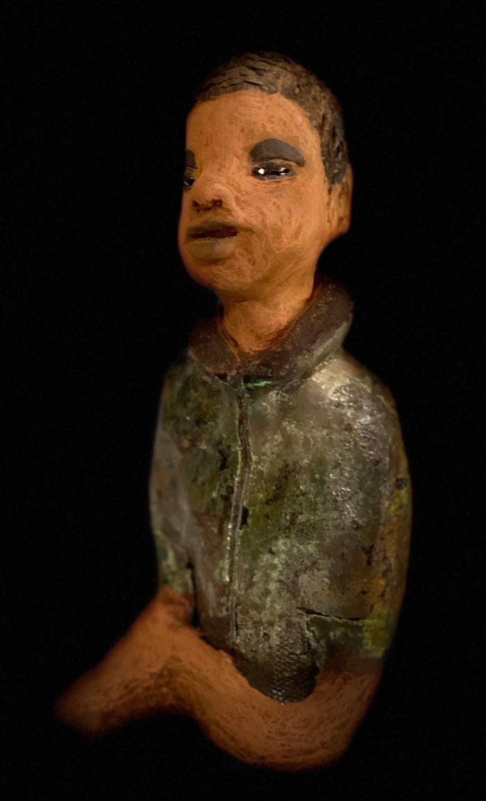 Ray is one confident teen who is ready to make his mark!  Ray stands 7"x 3" x 3" and weighs 14 ozs. He has a green metallic jacket with a high collar . Ray complexion is honey brown. His arms are folded as he ponders which college scholarship to accept!!