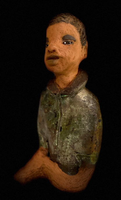 Ray is one confident teen who is ready to make his mark!  Ray stands 7"x 3" x 3" and weighs 14 ozs. He has a green metallic jacket with a high collar . Ray complexion is honey brown. His arms are folded as he ponders which college scholarship to accept!!