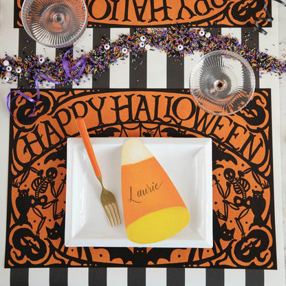 Wicked Halloween Placemat table set up with dinnerware and  halloween themed sprinkles