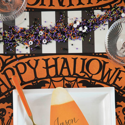 Wicked Halloween Placemat table set up with dinnerware and  halloween themed sprinkles